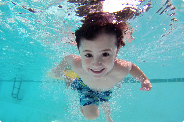 kid swimming in pool