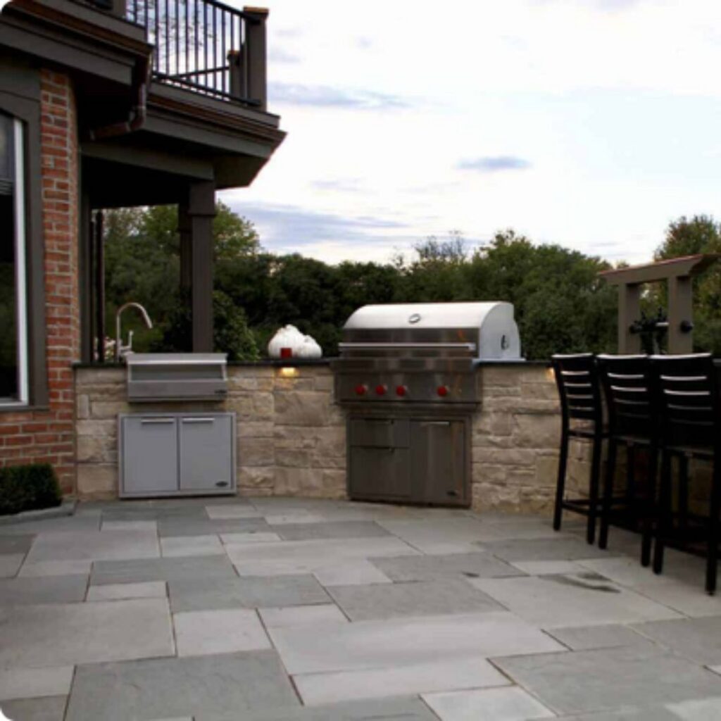 outdoor kitchen with nice paver patio